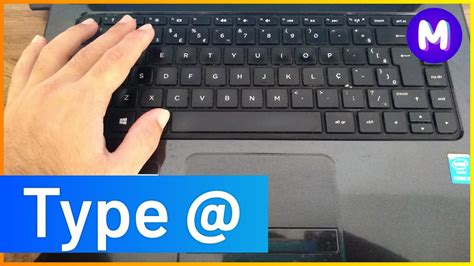at symbol on laptop.
